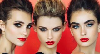 Three stunning models wearing Mirabella makeup on a vibrant red background, showcasing flawless beauty looks with gluten free cosmetics