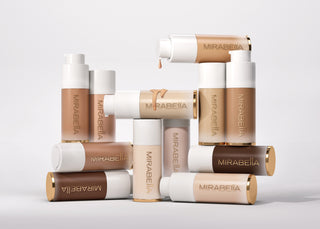 Image of Mirabella Anti Aging Mineral Foundation Makeup Stacked on each other Showcasing gluten free formulas on white 