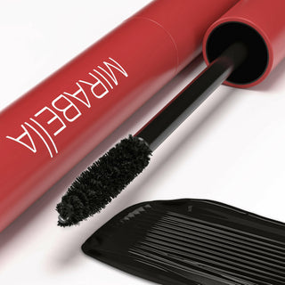 Close-up of Mirabella Lash Luxe Mascara spoolie, showing bristles for volume and length, highlighting smooth rich black liquid formula.