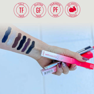 Model arm with applied swatch of Mirabella Eye Definer on skin 6 shades, with tube and outer packaging, core values of brand.