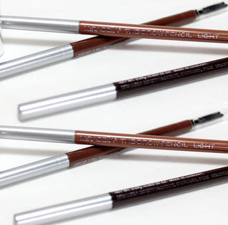 Close-up of Mirabella Brow Pencil in Light, Dark, and Medium shades, highlighting the sleek design of the pencil tube & spoolie.