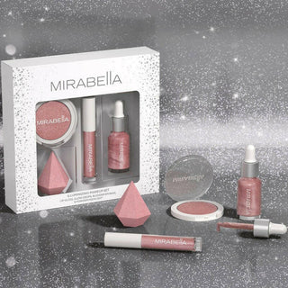 Illuminating Makeup Set's outer carton and individual pieces, such as blender sponge, pink lip gloss, highlighter, & glow drops, on silver background.