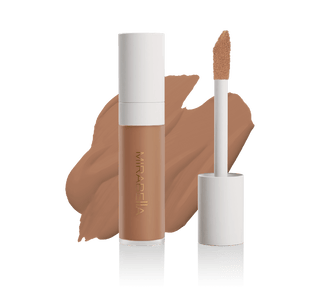 Mirabella Perfecting Liquid Concealer tube with doe-foot applicator and swatch in Tan T180, showcasing sleek design & precise application.