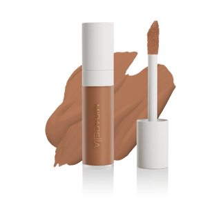 Mirabella Perfecting Liquid Concealer tube with doe-foot applicator and swatch in Tan T190, showcasing sleek design & precise application.