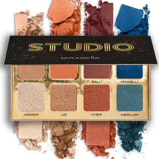 Studio eyeshadow palette shown opened on a white background with display of vibrantly pigmented eyeshadows above and below the palette.