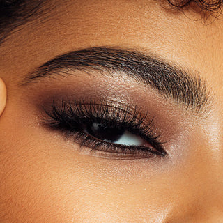 Close-up of Mirabella makeup model's eye wearing neutral eyeshadow and kohl liner for a sultry eye makeup look.