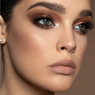 Close-up of Mirabella makeup model eye neutral eyeshadow and kohl liner for a sultry eye makeup look.