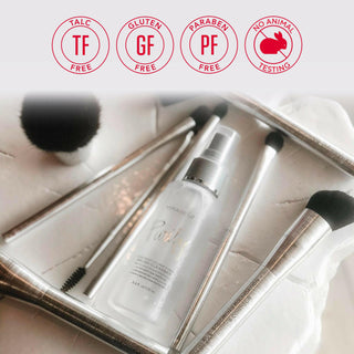 Close-up of Purify Brush Cleanser by Mirabella next to makeup brushes with the brand's core value emblems floating above the image.