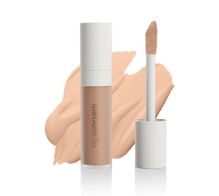 Invincible For All Perfecting Concealer Medium M120 frosted bottle with gold logo & applicator wand is shown in front of swatch.